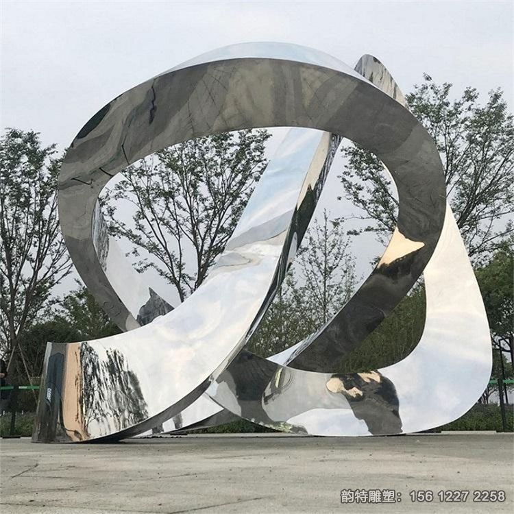 不銹鋼鏡面飄帶雕塑廠家，定做扭曲飄帶絲帶雕塑